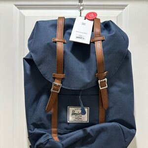 NWT HershelNavy backpack with red and white in stripe inside